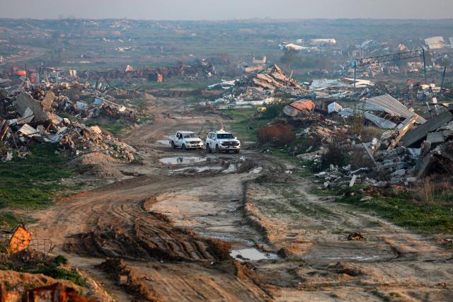 (260107) -- GAZA, Jan. 7, 2026 (Xinhua) -- Workers from the International Committee of the Red Cross search for the remains of the last Israeli hostage east of the Zeitoun neighborhood, southeast of Gaza City, on Jan. 7, 2025. A Hamas source said Wednesday the group has resumed searching for the remains of the last Israeli hostage held in the Gaza Strip. (Photo by Rizek Abdeljawad/Xinhua)