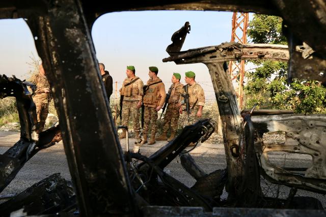 (260107) -- JWAYA, Jan. 7, 2026 (Xinhua) -- Lebanese army soldiers work near the wreckage of a car targeted by an Israeli airstrike in Jwaya, Lebanon, Jan. 7, 2026. An Israeli airstrike on the village of Jwaya in southern Lebanon Wednesday afternoon killed a Hezbollah member and injured another, according to Lebanese sources. (Photo by Ali Hashisho/Xinhua)