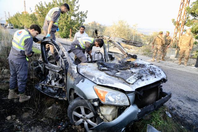 (260107) -- JWAYA, Jan. 7, 2026 (Xinhua) -- Lebanese army soldiers and paramedics work near the wreckage of a car targeted by an Israeli airstrike in Jwaya, Lebanon, Jan. 7, 2026. An Israeli airstrike on the village of Jwaya in southern Lebanon Wednesday afternoon killed a Hezbollah member and injured another, according to Lebanese sources. (Photo by Ali Hashisho/Xinhua)