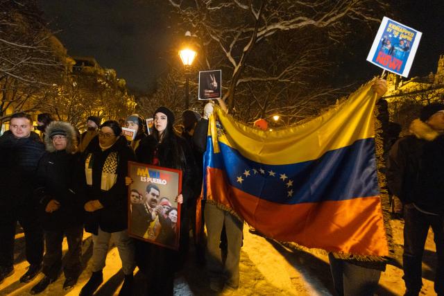 (260107) -- BUDAPEST, Jan. 7, 2026 (Xinhua) -- People take part in a protest opposing U.S. attack on Venezuela in front of the U.S. embassy in Budapest, Hungary, Jan. 7, 2026. (Photo by Attila Volgyi/Xinhua)