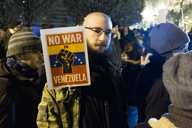 (260107) -- BUDAPEST, Jan. 7, 2026 (Xinhua) -- People take part in a protest opposing U.S. attack on Venezuela in front of the U.S. embassy in Budapest, Hungary, Jan. 7, 2026. (Photo by Attila Volgyi/Xinhua)