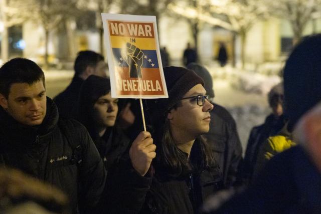 (260107) -- BUDAPEST, Jan. 7, 2026 (Xinhua) -- People take part in a protest opposing U.S. attack on Venezuela in front of the U.S. embassy in Budapest, Hungary, Jan. 7, 2026. (Photo by Attila Volgyi/Xinhua)