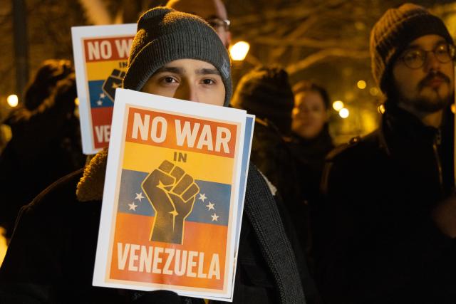(260107) -- BUDAPEST, Jan. 7, 2026 (Xinhua) -- People take part in a protest opposing U.S. attack on Venezuela in front of the U.S. embassy in Budapest, Hungary, Jan. 7, 2026. (Photo by Attila Volgyi/Xinhua)