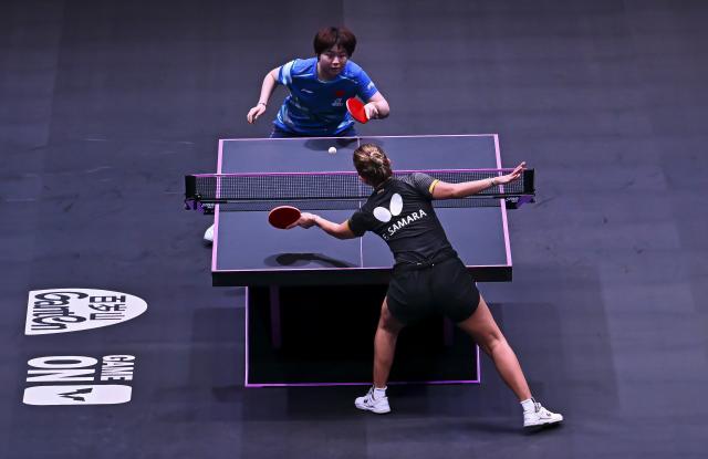 (260108) -- DOHA, Jan. 8, 2026 (Xinhua) -- Kuai Man (top) of China hits a return during the women's singles Round of 32 match against Elizabeta Samara of Romania at the WTT Champions Doha 2026 in Doha, Qatar, on Jan. 7, 2026. (Photo by Nikku/Xinhua)