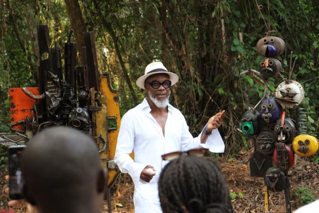 (260108) -- OUIDAH, Jan. 8, 2026 (Xinhua) -- This photo taken on Jan. 7, 2026 shows a scene of an exhibition entitled "N.ART.UREL" in the Pahou Classified Forest, in Ouidah, Benin. The second edition of the group exhibition opened on Wednesday in the Pahou Classified Forest on the outskirts of Ouidah, a historic cultural city in Benin. Themed on "The Muses of the Forest," the exhibition brings together around 30 artists, showcasing a wide range of art forms including sculpture, installation and painting. (Photo by Seraphin Zounyekpe/Xinhua)