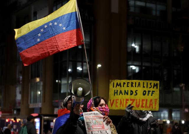 (260108) -- LONDON, Jan. 8, 2026 (Xinhua) -- Demonstrators attend a protest condemning U.S. attack on Venezuela outside King's Cross railway station in London, Britain, Jan. 7, 2026. (Xinhua/Li Ying)