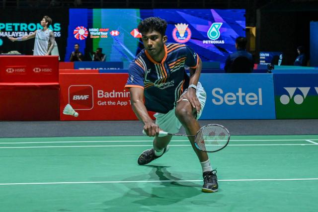 (260108) -- KUALA LUMPUR, Jan. 8, 2026 (Xinhua) - Ayush Shetty of India hits a return during the men's singles round of 16 match against Shi Yuqi of China at the Malaysia Open 2026 badminton tournament in Kuala Lumpur, Malaysia, Jan. 8, 2026. (Photo by Chong Voon Chung/Xinhua)