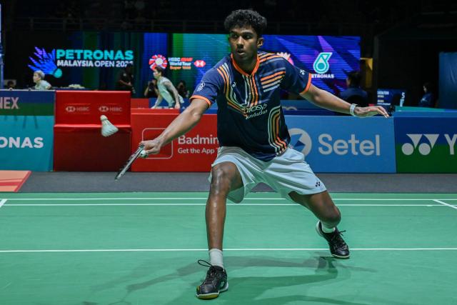 (260108) -- KUALA LUMPUR, Jan. 8, 2026 (Xinhua) - Ayush Shetty of India hits a return during the men's singles round of 16 match against Shi Yuqi of China at the Malaysia Open 2026 badminton tournament in Kuala Lumpur, Malaysia, Jan. 8, 2026. (Photo by Chong Voon Chung/Xinhua)