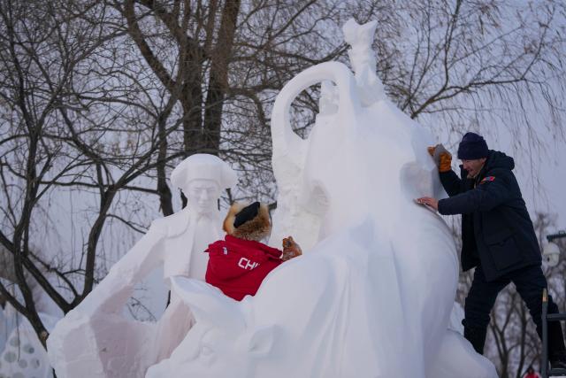 (260108) -- HARBIN, Jan. 8, 2026 (Xinhua) -- Contestants work on a snow sculpture at the Sun Island International Snow Sculpture Art Expo in Harbin, northeast China's Heilongjiang Province, Jan. 8, 2026. The 28th Harbin international snow sculpture competition kicked off here on Tuesday, attracting 25 teams of snow sculptors from 13 countries. (Xinhua/Wang Jianwei)