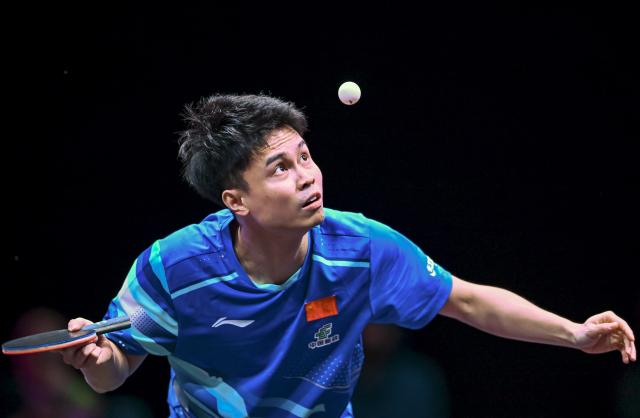 (260108) -- DOHA, Jan. 8, 2026 (Xinhua) -- Zhou Qihao of China serves during the men's singles Round of 32 match against An Jaehyun of South Korea at the WTT Champions Doha 2026 in Doha, Qatar, Jan. 8, 2026. (Photo by Nikku/Xinhua)