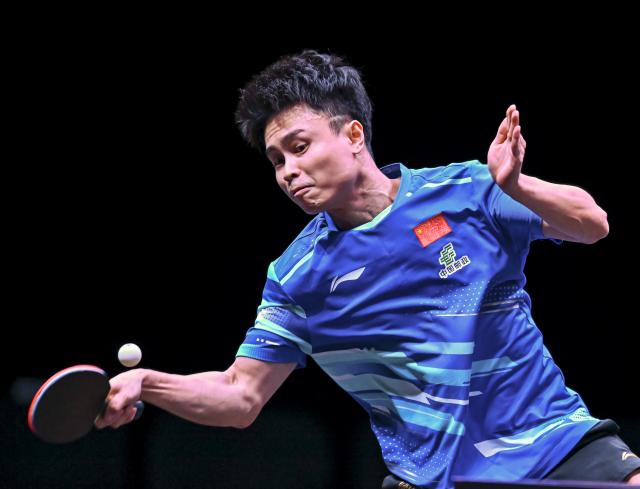 (260108) -- DOHA, Jan. 8, 2026 (Xinhua) -- Zhou Qihao of China hits a return during the men's singles Round of 32 match against An Jaehyun of South Korea at the WTT Champions Doha 2026 in Doha, Qatar, Jan. 8, 2026. (Photo by Nikku/Xinhua)