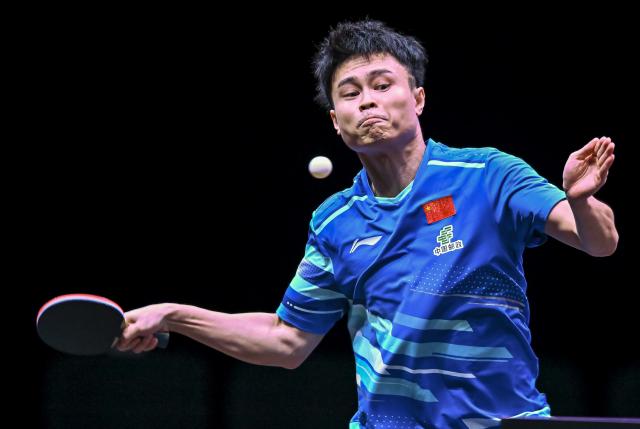 (260108) -- DOHA, Jan. 8, 2026 (Xinhua) -- Zhou Qihao of China hits a return during the men's singles Round of 32 match against An Jaehyun of South Korea at the WTT Champions Doha 2026 in Doha, Qatar, Jan. 8, 2026. (Photo by Nikku/Xinhua)
