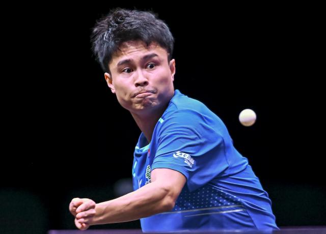 (260108) -- DOHA, Jan. 8, 2026 (Xinhua) -- Zhou Qihao of China hits a return during the men's singles Round of 32 match against An Jaehyun of South Korea at the WTT Champions Doha 2026 in Doha, Qatar, Jan. 8, 2026. (Photo by Nikku/Xinhua)