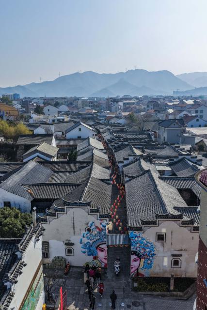 (260108) -- JINHUA, Jan. 8, 2026 (Xinhua) -- An aerial drone photo taken on Jan. 8, 2026 shows a view of the renovated Poyang ancient street in Jindong District of Jinhua City, east China's Zhejiang Province. In recent years, Jindong District of Jinhua City has developed the cultural and tourism industry by leveraging its cultural, sports and music resources, creating new consumption scenarios for tourism with distinctive features, including sports parks, camping bases, old rural streets and ceramic art galleries. (Xinhua/Xu Yu)