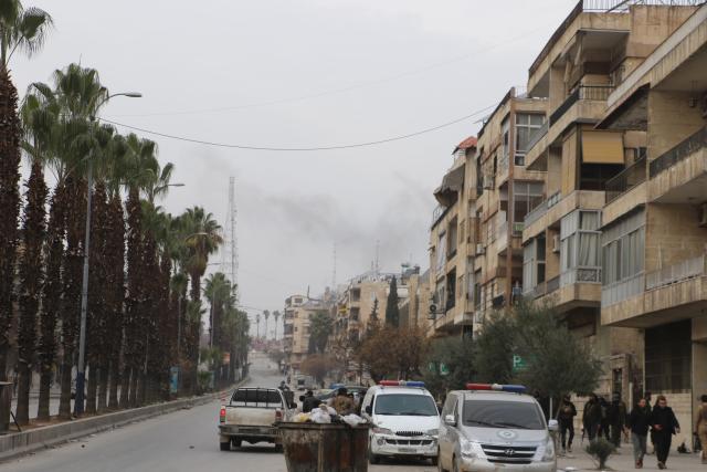 (260108) -- DAMASCUS, Jan. 8, 2026 (Xinhua) -- Syrian security vehicles are seen parked along a street outside the Ashrafieh neighborhood in Aleppo city, Syria, Jan. 8, 2026. The Syrian army on Thursday launched intense shelling targeting positions of the Syrian Democratic Forces (SDF) in the Sheikh Maqsoud and Ashrafieh neighborhoods of Aleppo, the state-run SANA news agency reported. (Str/Xinhua)