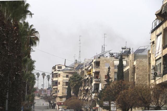 (260108) -- DAMASCUS, Jan. 8, 2026 (Xinhua) -- Smoke rises over residential buildings near the Ashrafieh neighborhood in Aleppo city, Syria, Jan. 8, 2026. The Syrian army on Thursday launched intense shelling targeting positions of the Syrian Democratic Forces (SDF) in the Sheikh Maqsoud and Ashrafieh neighborhoods of Aleppo, the state-run SANA news agency reported. (Str/Xinhua)