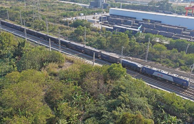 (260108) -- NANNING, Jan. 8, 2026 (Xinhua) -- A drone photo taken on Jan. 8, 2026 shows a train leaving the Nanning International Railway Port in Nanning, south China's Guangxi Zhuang Autonomous Region. China's New International Land-Sea Trade Corridor rail service handled a record 1.425 million twenty-foot equivalent units (TEUs) of cargo in 2025, marking a 47.6 percent increase and surpassing the one-million-TEU milestone for the first time, China Railway Nanning Group said on Tuesday. (Xinhua/Zhou Hua)