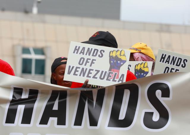 (260108) -- PRETORIA, Jan. 8, 2026 (Xinhua) -- People take part in a protest opposing U.S. attack on Venezuela in front of the U.S. embassy in Pretoria, South Africa, Jan. 8, 2026. (Xinhua/Chen Wei)