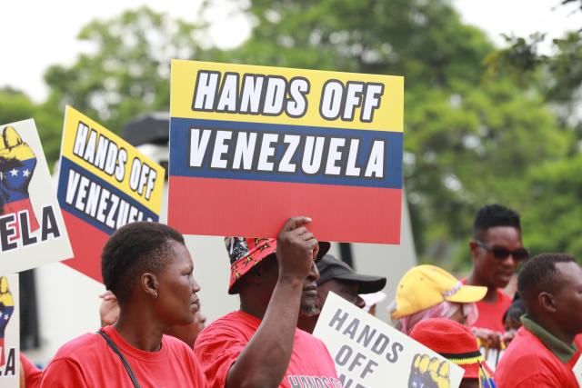 (260108) -- PRETORIA, Jan. 8, 2026 (Xinhua) -- People take part in a protest opposing U.S. attack on Venezuela in front of the U.S. embassy in Pretoria, South Africa, Jan. 8, 2026. (Xinhua/Chen Wei)