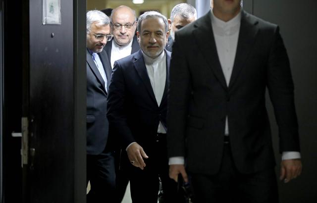 (260108) -- BEIRUT, Jan. 8, 2026 (Xinhua) -- The photo taken on Jan. 8, 2026 shows Iranian Foreign Minister Araghchi (C) entering a room to meet with Lebanese Economy and Trade Minister Amer Bisat in Beirut. Iran is prepared for war if forced into confrontation but does not seek one, Iranian Foreign Minister Abbas Araghchi said on Thursday, while stressing Tehran remains open to negotiations based on mutual respect. (Photo by Bilal Jawich/Xinhua)
