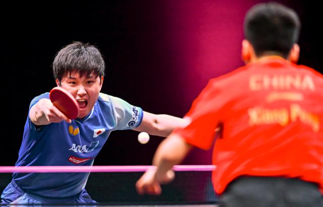 (260109) -- DOHA, Jan. 9, 2026 (Xinhua) -- Tomokazu Harimoto of Japan hits a return during the men's singles Round of 32 match against Xiang Peng of China at the WTT Champions Doha 2026 in Doha, Qatar, on Jan. 8, 2026. (Photo by Nikku/Xinhua)