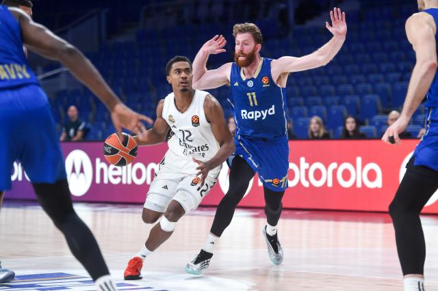 (260109) -- MADRID, Jan. 9, 2026 (Xinhua) -- Real Madrid's Theo Maledon (2nd L) breaks through during the Euroleague basket game between Real Madrid and Maccabi Rapyd Tel Aviv, at Movistar Arena, in Madrid, Spain, on Jan. 8, 2026. (Photo by Gustavo Valiente/Xinhua)