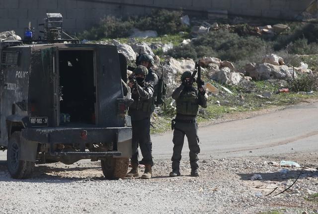 (260109) -- NABLUS, Jan. 9, 2026 (Xinhua) -- Members of Israeli forces stand guard during a house demolition operation in the Upper Ta'awun area of Nablus in the West Bank on Jan. 8, 2026. (Photo by Nidal Eshtayeh/Xinhua)