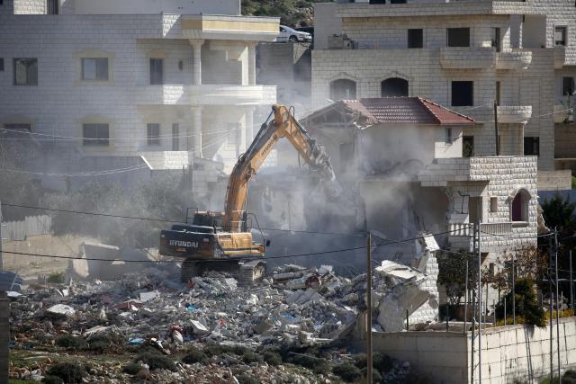 (260109) -- NABLUS, Jan. 9, 2026 (Xinhua) -- An Israeli excavator demolishes a house in the Upper Ta'awun area of Nablus in the West Bank on Jan. 8, 2026. (Photo by Nidal Eshtayeh/Xinhua)