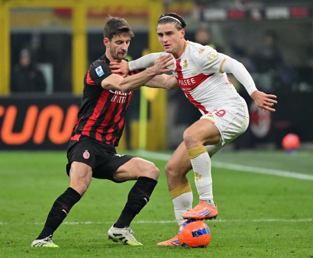 (260109) -- MILAN, Jan. 9, 2026 (Xinhua) -- AC Milan's Matteo Gabbia (L) vies with Genoa's Lorenzo Colombo during a Serie A football match between AC Milan and Genoa in Milan, Italy, Jan.8, 2026. (Photo by Alberto Lingria/Xinhua)