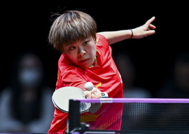 (260109) -- DOHA, Jan. 9, 2026 (Xinhua) -- Wang Yidi of China hits a return during the women's singles round of 16 match against Sofia Polcanova of Austria at the WTT Champions Doha 2026 in Doha, Qatar, Jan. 9, 2026. (Photo by Nikku/Xinhua)