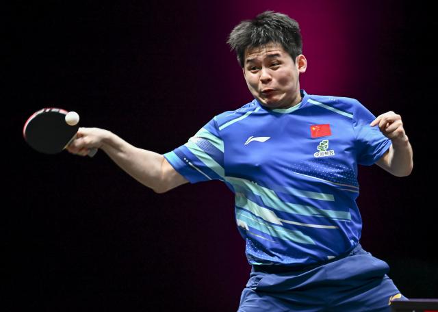 (260109) -- DOHA, Jan. 9, 2026 (Xinhua) -- Lin Shidong of China hits a return during the men's singles Round of 16 match against Benedikt Duda of Germany at the WTT Champions Doha 2026 in Doha, Qatar, Jan. 9, 2026. (Photo by Nikku/Xinhua)
