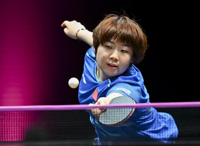 (260109) -- DOHA, Jan. 9, 2026 (Xinhua) -- Kuai Man of China hits a return during the women's singles Round of 16 match against Hayata Hina of Japan at the WTT Champions Doha 2026 in Doha, Qatar, Jan. 9, 2026. (Photo by Nikku/Xinhua)