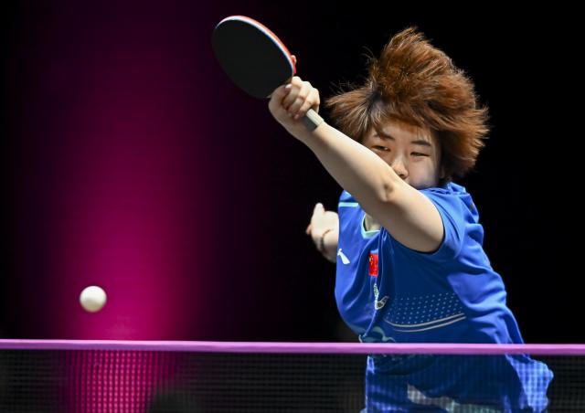 (260109) -- DOHA, Jan. 9, 2026 (Xinhua) -- Kuai Man of China hits a return during the women's singles Round of 16 match against Hayata Hina of Japan at the WTT Champions Doha 2026 in Doha, Qatar, Jan. 9, 2026. (Photo by Nikku/Xinhua)