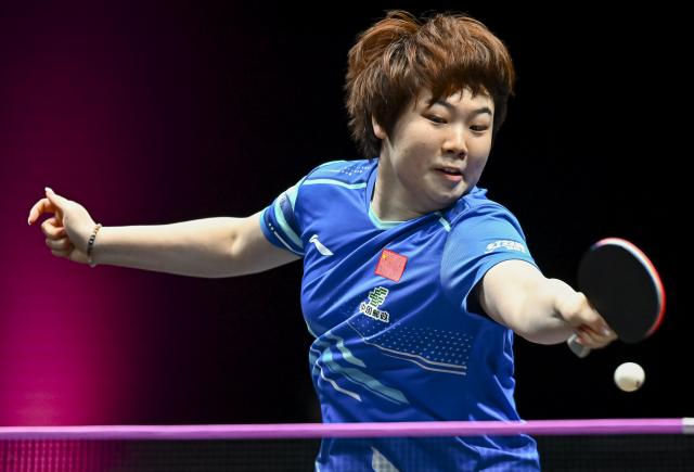 (260109) -- DOHA, Jan. 9, 2026 (Xinhua) -- Kuai Man of China hits a return during the women's singles Round of 16 match against Hayata Hina of Japan at the WTT Champions Doha 2026 in Doha, Qatar, Jan. 9, 2026. (Photo by Nikku/Xinhua)