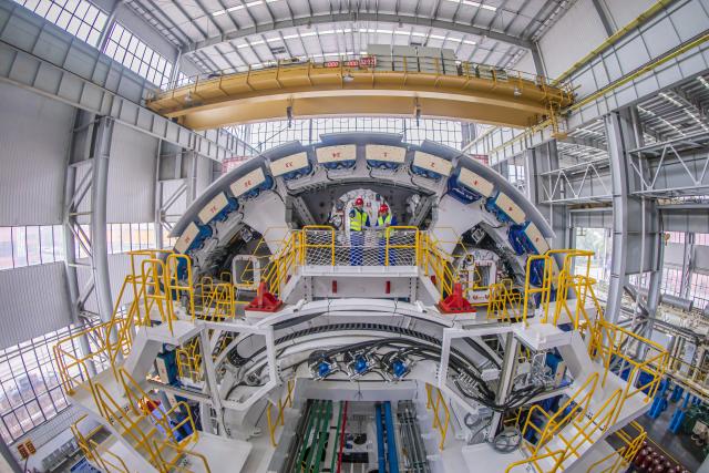 (260109) -- BEIJING, Jan. 9, 2026 (Xinhua) -- Staff members conduct acceptance procedures for the tunnel boring machine "Xi Yi" in Changsha, central China's Hunan Province, Jan. 9, 2026. The "Xi Yi" and "Xi Wang" tunnel boring machines designed for the construction of the intercity rail line S2 connecting Wuxi City and Yixing City in east China's Jiangsu Province rolled off on Friday. (Photo by Hu Anjiang/Xinhua)