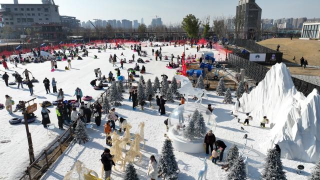 (260109) -- HANGZHOU, Jan. 9, 2026 (Xinhua) -- A drone photo taken on Jan. 9, 2026 shows people enjoying themselves at an ice and snow carnival in Hangzhou, east China's Zhejiang Province. An ice and snow carnival kicked off at the Hangzhou grand canal steelworks park on Friday, attracting visitors across the city.  
  Since 2020, Hangzhou has been undertaking the preservation and transformation of industrial relics from Hangzhou iron and steel group's factory, aiming to create an urban complex park that integrates industrial, commercial, and recreational facilities. Currently, the first phase of the construction project has been put into use, while the second phase is set to be completed and operational by 2028. (Xinhua/Weng Xinyang)