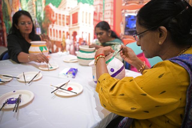 (260109) -- SINGAPORE, Jan. 9, 2026 (Xinhua) -- People paint on traditional clay pots used for Pongal Festival activities during a media preview of the Pongal Festival celebration held in Singapore's Indian Heritage Centre on Jan. 9, 2026.
  Pongal Festival is a tradition celebrated in south India. This year's festival is held from Jan. 14 to 17. Singapore's Indian Heritage Centre will be hosting a series of Pongal Festival activities on the two weekends on Jan 10, 11, 17 and 18. (Photo by Then Chih Wey/Xinhua)