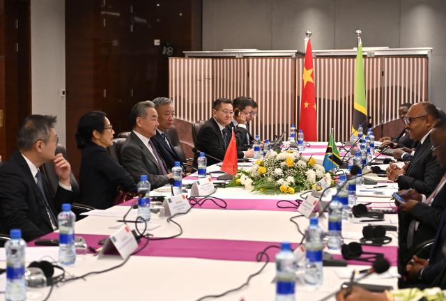 (260109) -- DAR ES SALAAM, Jan. 9, 2026 (Xinhua) -- Chinese Foreign Minister Wang Yi, also a member of the Political Bureau of the Communist Party of China Central Committee, meets with Tanzanian Minister of Foreign Affairs and East African Cooperation Mahmoud Thabit Kombo, in Dar es Salaam, Tanzania, Jan. 9, 2026. (Xinhua/Liu Qiong)