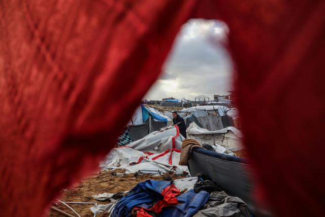 (260109) -- GAZA, Jan. 9, 2026 (Xinhua) -- A Palestinian inspects the damage caused by an Israeli strike that targeted a camp housing displaced people in Gaza City, on Jan. 9, 2026. (Photo by Rizek Abdeljawad/Xinhua)