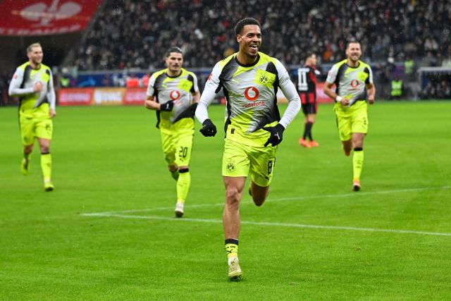 (260110) -- FRANKFURT, Jan. 10, 2026 (Xinhua) -- Felix Nmecha (front) of Borussia Dortmund celebrates scoring during the German first division Bundesliga football match between Eintracht Frankfurt and Borussia Dortmund in Frankfurt, Germany, Jan. 9, 2026. (Photo by Ulrich Hufnagel/Xinhua)