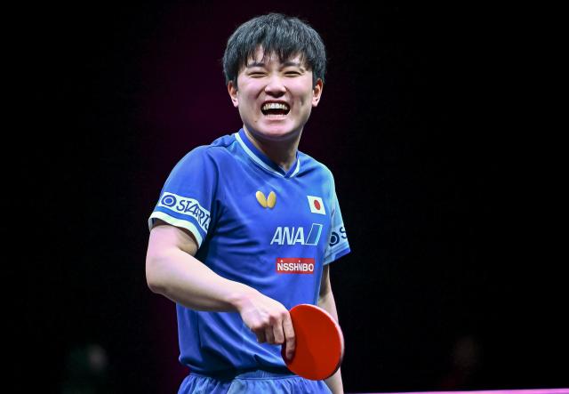 (260110) -- DOHA, Jan. 10, 2026 (Xinhua) -- Harimoto Tomokazu of Japan reacts during the men's singles Round of 16 match against Zhou Qihao of China at the WTT Champions Doha 2026 in Doha, Qatar, Jan. 9, 2026. (Photo by Nikku/Xinhua)