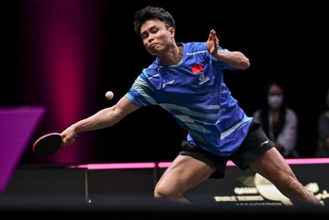 (260110) -- DOHA, Jan. 10, 2026 (Xinhua) -- Zhou Qihao of China hits a return during the men's singles Round of 16 match against Harimoto Tomokazu of Japan at the WTT Champions Doha 2026 in Doha, Qatar, Jan. 9, 2026. (Photo by Nikku/Xinhua)
