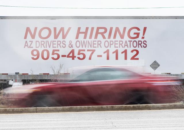 (260110) -- TORONTO, Jan. 10, 2026 (Xinhua) -- A vehicle runs past a job board by a street in Toronto, Canada, Jan. 9, 2026. Canada's unemployment rate rose to 6.8 percent in December, Statistics Canada announced Friday. (Photo by Zou Zheng/Xinhua)