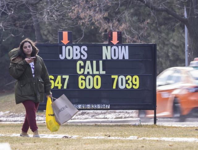 (260110) -- TORONTO, Jan. 10, 2026 (Xinhua) -- A woman walks past a job board by a street in Toronto, Canada, Jan. 9, 2026. Canada's unemployment rate rose to 6.8 percent in December, Statistics Canada announced Friday. (Photo by Zou Zheng/Xinhua)