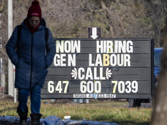 (260110) -- TORONTO, Jan. 10, 2026 (Xinhua) -- A pedestrian walks past a job board by a street in Toronto, Canada, Jan. 9, 2026. Canada's unemployment rate rose to 6.8 percent in December, Statistics Canada announced Friday. (Photo by Zou Zheng/Xinhua)