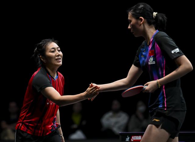 (260110) -- DOHA, Jan. 10, 2026 (Xinhua) -- Han Ying (L) of Germany shakes hands with Chen Yi of China after their women's singles Round of 16 match at the WTT Champions Doha 2026 in Doha, Qatar, on Jan. 9, 2026. (Photo by Nikku/Xinhua)