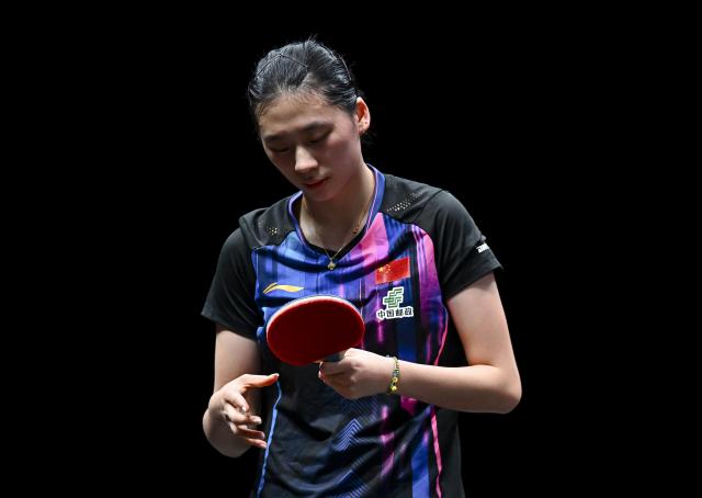 (260110) -- DOHA, Jan. 10, 2026 (Xinhua) -- Chen Yi of China reacts during the women's singles Round of 16 match against Han Ying of Germany at the WTT Champions Doha 2026 in Doha, Qatar, on Jan. 9, 2026. (Photo by Nikku/Xinhua)