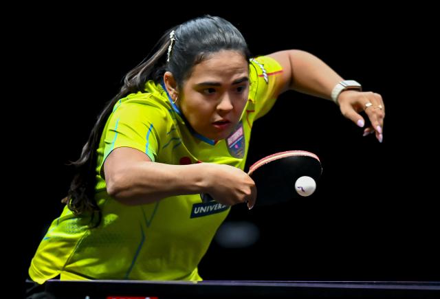 (260110) -- DOHA, Jan. 10, 2026 (Xinhua) -- Adriana Diaz of Puerto Rico hits a return during the women's singles Round of 16 match against Zhu Yuling of China's Macao at the WTT Champions Doha 2026 in Doha, Qatar, on Jan. 9, 2026. (Photo by Nikku/Xinhua)