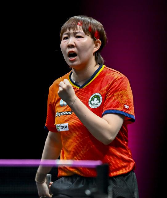 (260110) -- DOHA, Jan. 10, 2026 (Xinhua) -- Zhu Yuling of China's Macao celebrates during the women's singles Round of 16 match against Adriana Diaz of Puerto Rico at the WTT Champions Doha 2026 in Doha, Qatar, on Jan. 9, 2026. (Photo by Nikku/Xinhua)