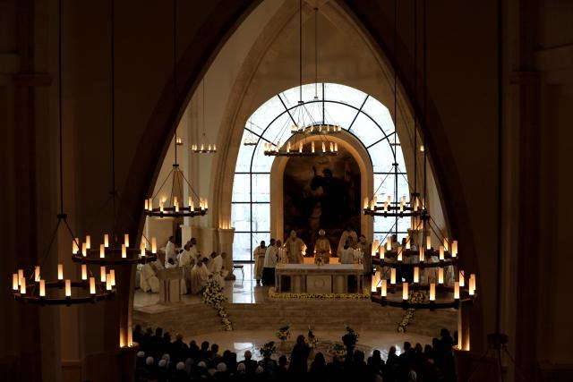 (260110) -- JORDAN RIVER, Jan. 10, 2026 (Xinhua) -- Christian Catholics attend an annual pilgrimage at the Baptism Site on the eastern bank of Jordan River, Jordan, Jan. 9, 2026. (Photo by Mohammad Abu Ghosh/Xinhua)